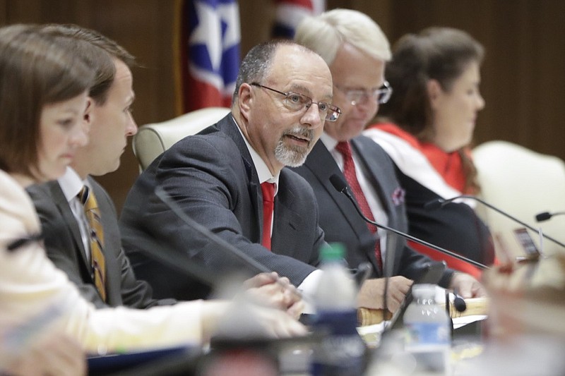 Sen. Mike Bell, R-Riceville, center, chairs a Tennessee Senate hearing to discuss a fetal heartbeat abortion ban, or possibly something more restrictive, Monday, Aug. 12, 2019, in Nashville, Tenn. (AP Photo/Mark Humphrey)