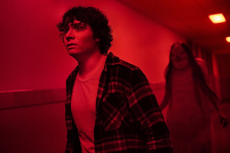 In this image released by CBS Films, Austin Zajur as Chuck Steinberg appears in the film, Scary Stories to Tell in the Dark," to be released by CBS Films and Lionsgate. (George Kraychyk/CBS Films via AP)
