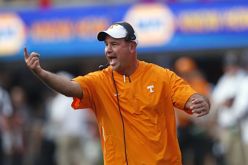 In this Sept. 29, 2018, file photo, Tennessee head coach Jeremy Pruitt yells to his players during an NCAA college football game against Georgia in Athens, Ga. Pruitt believes his team can benefit from the lessons he learned in his debut season as a head coach. (AP Photo/John Bazemore, File)
