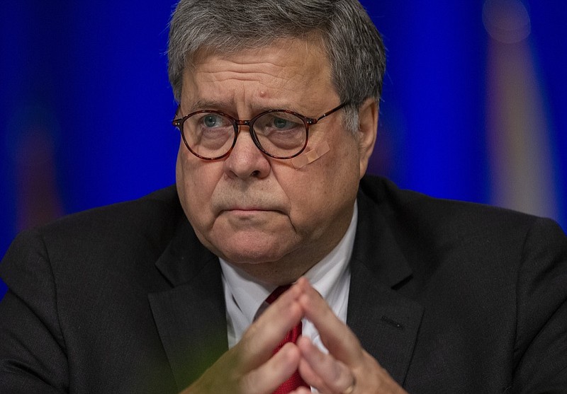 United States Attorney General William Barr, listens to LaToya Cantrell, New Orleans mayor, during the Grand Lodge Fraternal Order of Police's 64th National Biennial Conference at the Ernest N. Morial Convention Center on Convention Blvd. in New Orleans, La. Monday, Aug. 12, 2019. Barr said Monday that there were "serious irregularities" at the federal jail where Jeffrey Epstein took his own life this weekend as he awaited trial on charges he sexually abused underage girls. (David Grunfeld/The Advocate via AP)