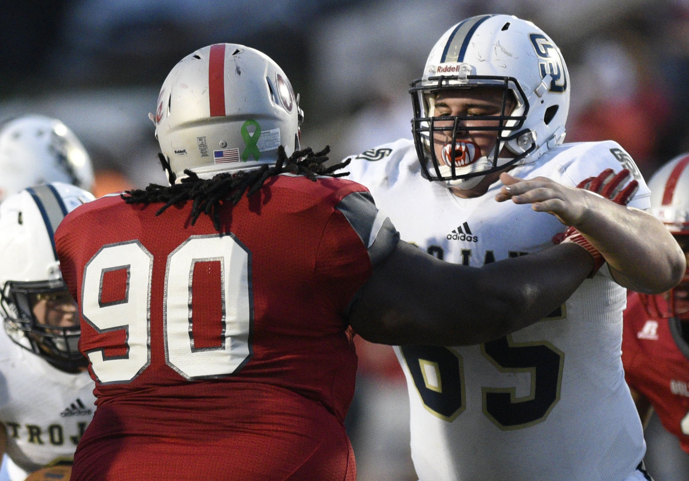 Soddy-Daisy's Will Riddick (65) blocks Ooltwah's Matyeus Crutcher (90). The Soddy-Daisy Trojans visited the Ooltewah Owls in a TSSAA rivalry game on September 21, 2018.