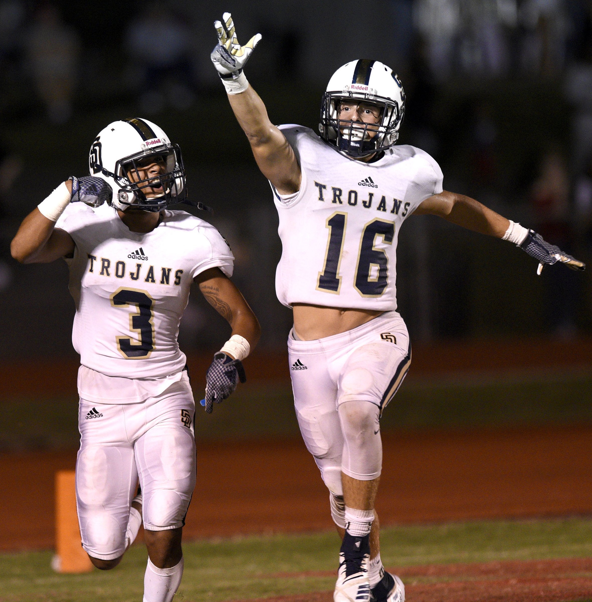 KeSean Eubanks (3) and Landen Reece (16) celebrate Eubank's touchdown. The Soddy-Daisy Trojans visited the Ooltewah Owls in a TSSAA rivalry game on September 21, 2018.