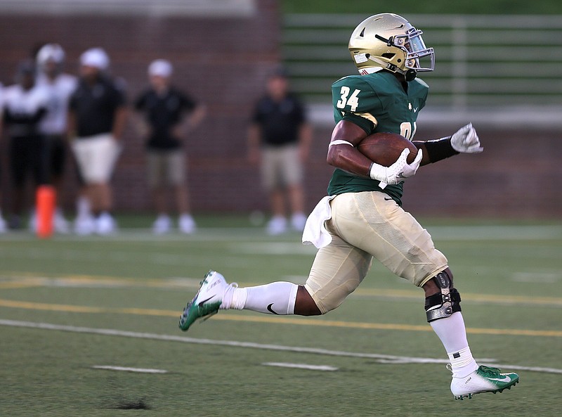 Notre Dame's Jeffrey Watkins Jr. (34) runs the ball during the Notre Dame vs. Bradley Central game in the Best of Preps football jamboree Friday, August 10, 2018 at Finley Stadium in Chattanooga, Tennessee. 