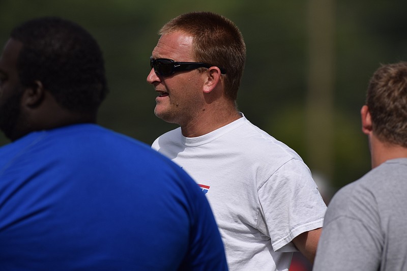 Red Bank head coach Chad Grabowski talks to his assistant coaches.  Ooltewah, Soddy-Daisy, Red Bank and Bradley Central took part in a 7 on 7 scrimmage at Ooltewah HIgh School, July 8, 2015.