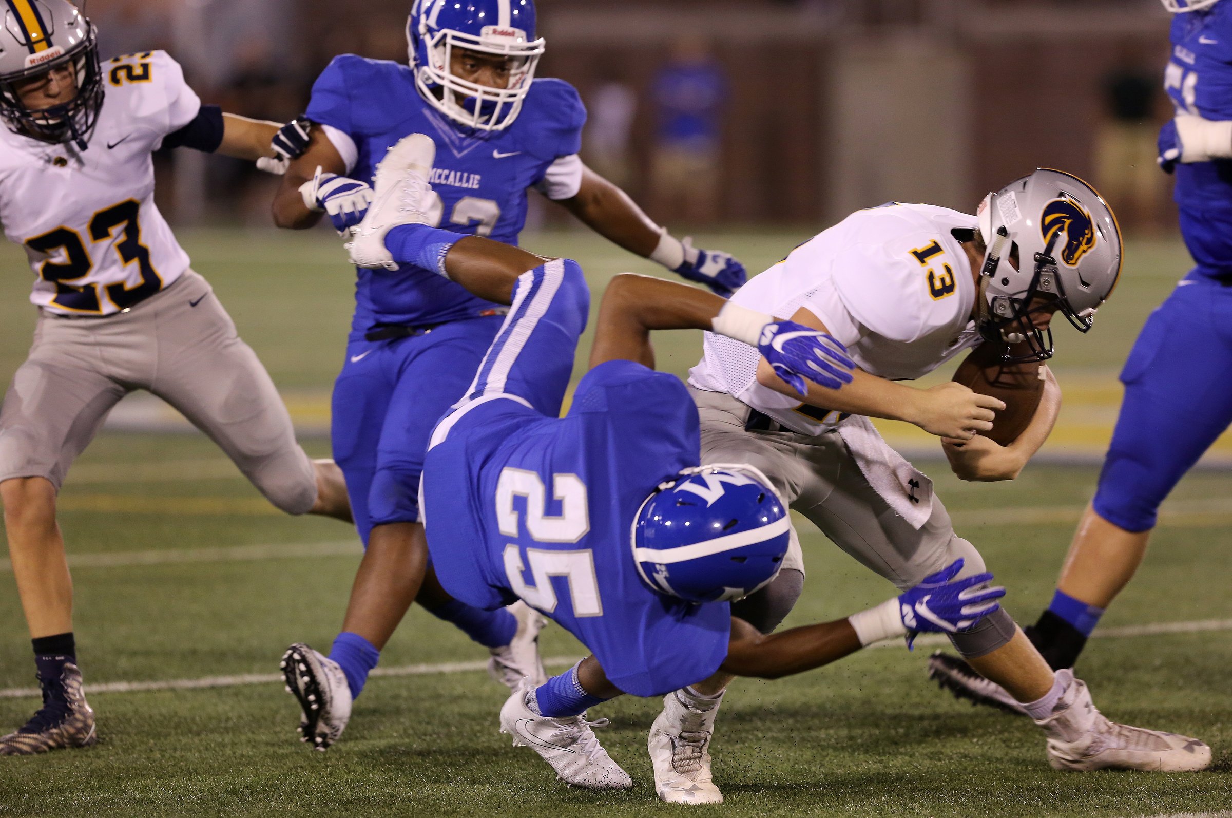 McCallie's Manny Mitchell (25) attempts to trip up Walker Valley's Daniel Denton (13) during the McCallie vs. Walker Valley game in the Best of Preps football jamboree Friday, August 10, 2018 at Finley Stadium in Chattanooga, Tennessee.