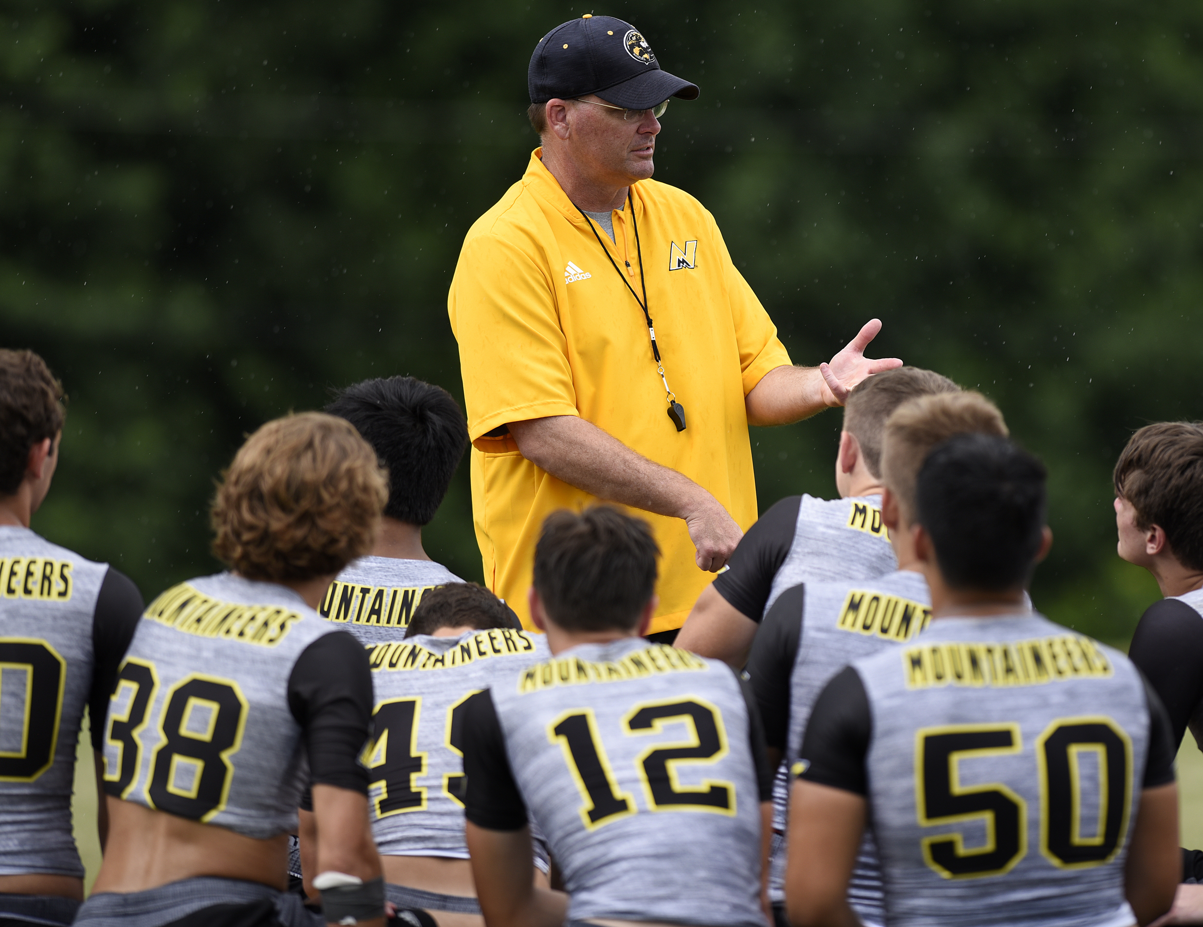 North Murray head coach Preston Poag talks to his team following a 7-on-7 scrimmage Thursday, June 21, 2018 at Southeast Whitfield High School in Dalton, Georgia.