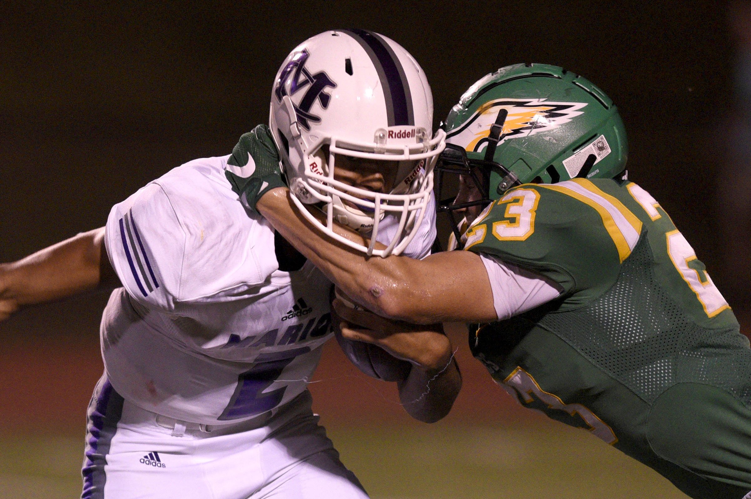 Rhea County's Jackson Langley (23) grabs Marion's Toney Sampson (2) in the backfield. The Marion County Warriors visited the Rhea County Golden Eagles in a TSSAA rivalry game on October 5, 2018.