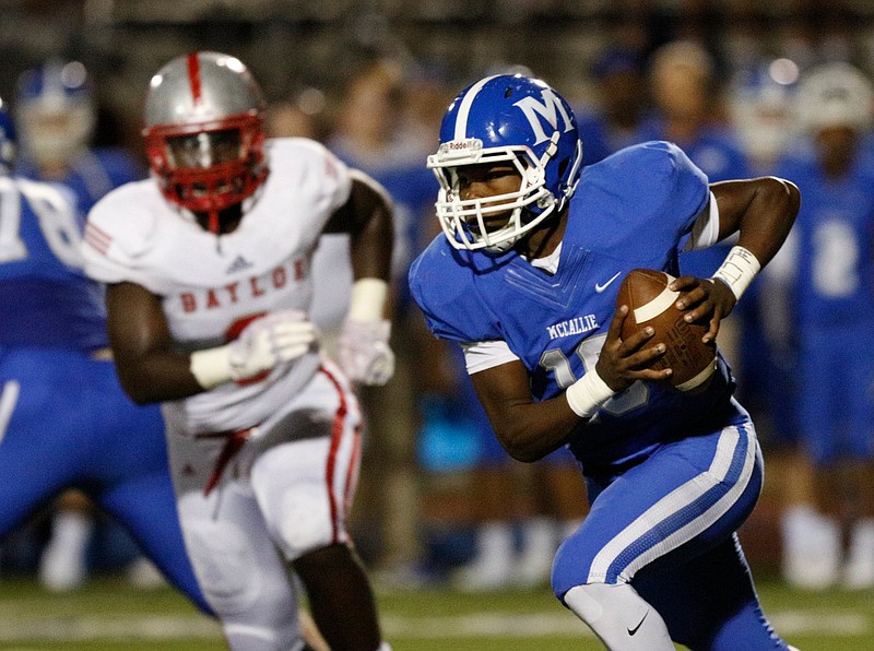 McCallie player DeAngelo Hardy (10) carries around Baylor player Christian Harris (9) during their prep rivalry football game at McCallie School on Friday, Oct. 12, 2018, in Chattanooga, Tenn. 