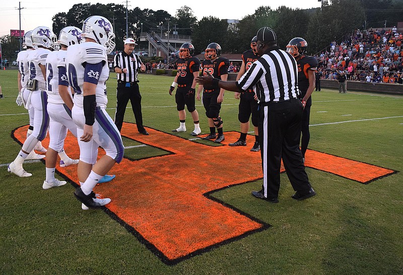 Marion County and South Pittsburg game captains meet at midfield.  The Marion County Warriors visited the South Pittsburg Pirates in TSSAA football action on September 2, 2016. 