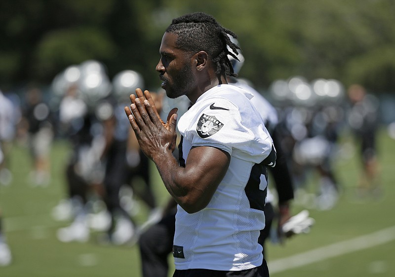 FILE - In this June 11, 2019, file photo, Oakland Raiders wide receiver Antonio Brown is shown during an NFL football minicamp in Alameda, Calif. The Raiders and their big personalities like Antonio Brown and Richie Incognito are ready to be stars on HBO's "Hard Knocks." (AP Photo/Eric Risberg, File)