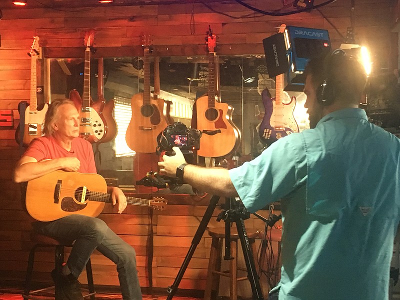 Local singer/songwriter Roger Alan Wade is shown performing at Mayo's on Brainerd Road as part of the WTCI-TV 45 campaign to promote the Ken Burns documentary series "Country Music," which will debut on PBS Sept. 15.