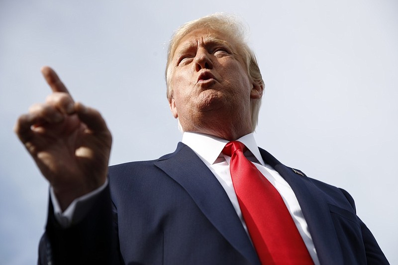 President Donald Trump speaks with reporters before boarding Air Force One at Morristown Municipal Airport in Morristown, N.J., Thursday, Aug. 15, 2019, en route to a campaign rally in Manchester, N.H. (AP Photo/Patrick Semansky)