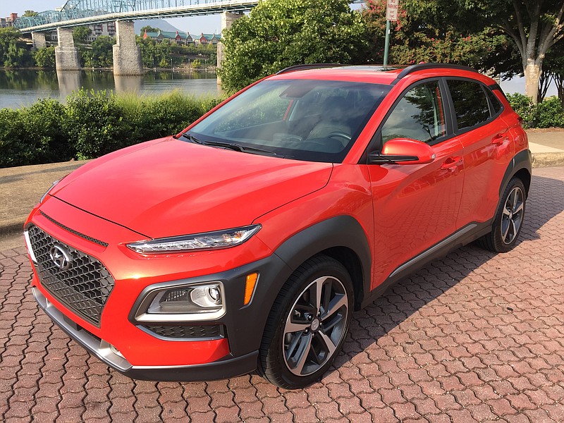 The Hyundai Kona Ultimate is shown in Sunset Orange.