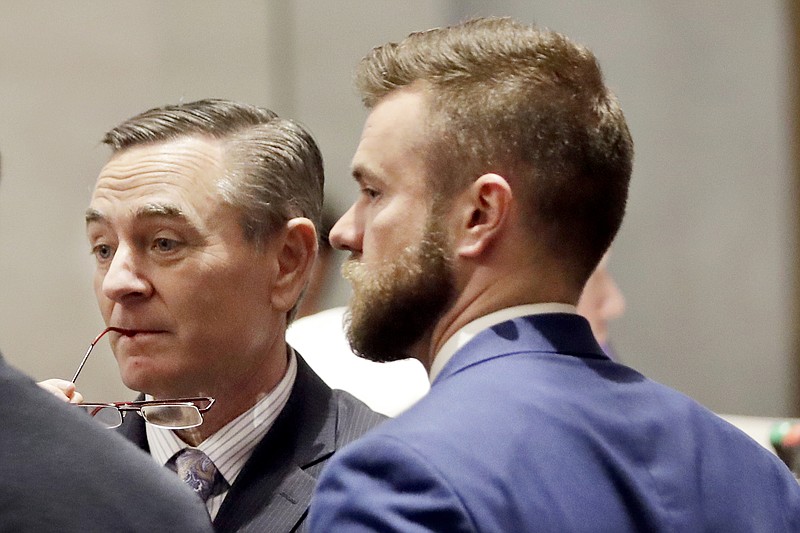 FILE - In this May 2, 2019, file photo, House Speaker Glen Casada, R-Franklin, left, talks with Cade Cothren, right, his chief of staff, during a House session in Nashville, Tenn.Tennessee Judge Dianne Turner ruled on Thursday, August 15, 2019 that special prosecutor Coffee County District Attorney Craig Northcott, who has come under fire for making anti-gay and anti-Islam remarks, will continue to handle activist Justin Jones’s court case.  (AP Photo/Mark Humphrey, File)