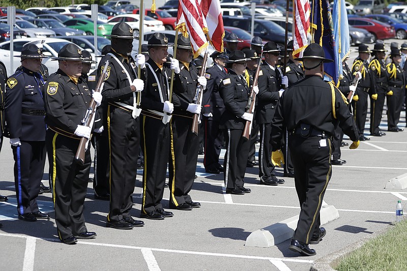 An honor guard made up of corrections officers from various states attends the funeral for Tennessee Department of Correction administrator Debra Johnson Friday, Aug. 16, 2019, in Nashville, Tenn. Officials say inmate Curtis Watson killed Johnson before his escape from the West Tennessee State Penitentiary Aug. 7. (AP Photo/Mark Humphrey)