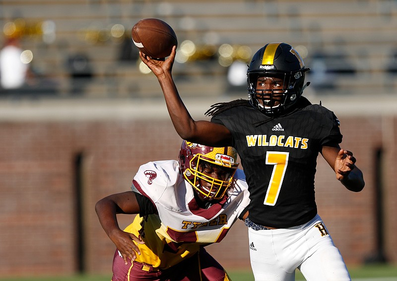 Staff file photo / Hixson quarterback Richard Hunter passes under pressure from Tyner's Jaylon Clay during the the first day of the 2019 Best of Preps jamboree at Finley Stadium on Aug. 16.