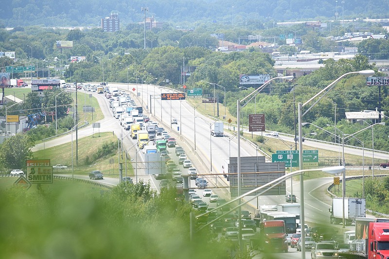 Staff photo by Tim Barber/ In this 3:00 p.m. view, Interstate 24 traffic stands almost still after a tractor trailer overturned at the 181 exit, west of the Missionary Ridge cut at 7:15 a.m. Sunday, Aug. 18, 2019.