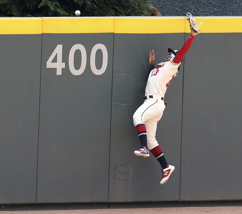 Atlanta Braves outfielder Ronald Acuna Jr. is unable to hold on to a three-run home run by the Los Angeles Dodgers' Cody Bellinger during the first inning of Sunday's game at SunTrust Park. Acuna was removed from the game later by Braves manager Brian Snitker after failing to hustle out of the batter's box on a deep fly ball.