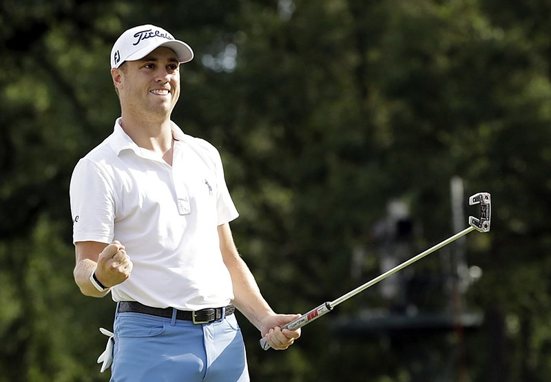 Justin Thomas celebrates after making a birdie on the final hole of the BMW Championship at Medinah (Illinois) Country Club on Sunday. Thomas, who had a six-shot lead after three rounds, closed with a 68 to win by three strokes over Patrick Cantlay.