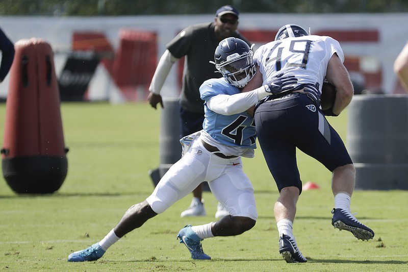 Tennessee Titans defensive back JoJo Tillery (47) tackles tight end Parker Hesse (49) during NFL football training camp Monday, July 29, 2019, in Nashville, Tenn. (AP Photo/Mark Humphrey)