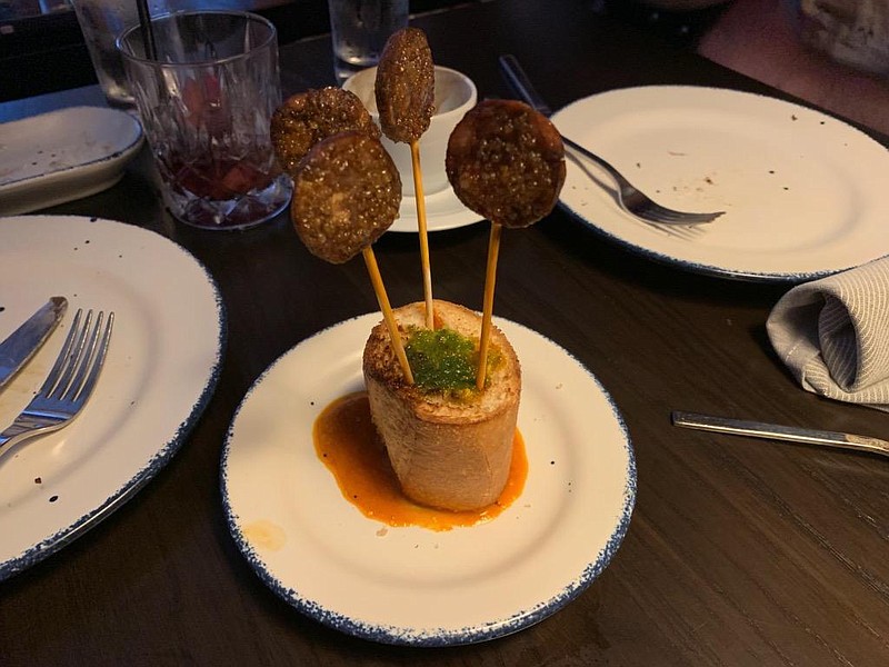 Caramelized chorizo lollipops with romesco sauce at Paloma.