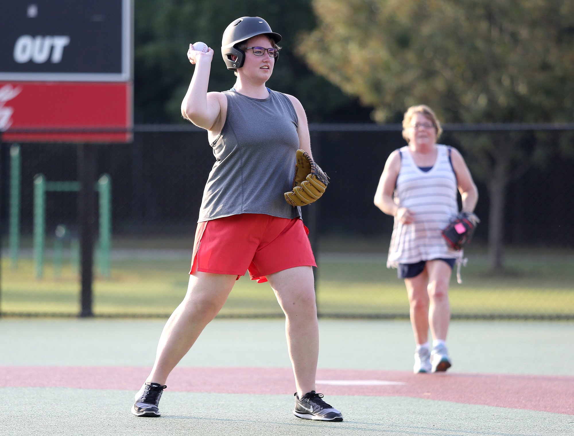 Staff photo by Erin O. Smith / Gracie Colby, 17, throws the ball to first during the Miracle League survivors vs. miracles ball game August 20, 2019 in Chattanooga, Tennessee. The event was a part of the monthly support group for those with brain injuries and was held to promote education on brain injuries and encourage socialization among those those with brain injuries.