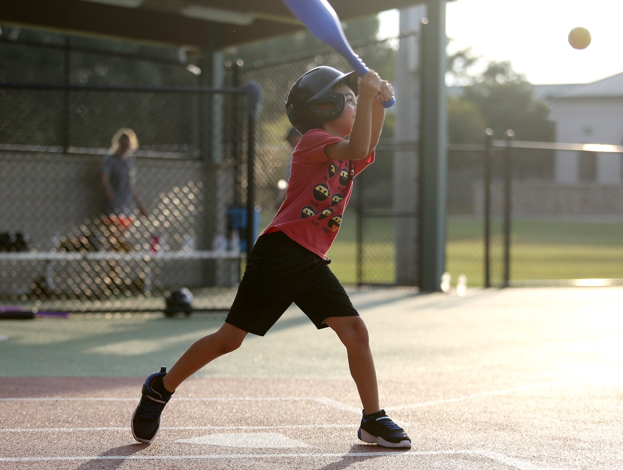 Staff photo by Erin O. Smith / Joseph Swabb, 7, swings at a pitch during the Miracle League survivors vs. miracles ball game August 20, 2019 in Chattanooga, Tennessee. The event was a part of the monthly support group for those with brain injuries and was held to promote education on brain injuries and encourage socialization among those those with brain injuries.