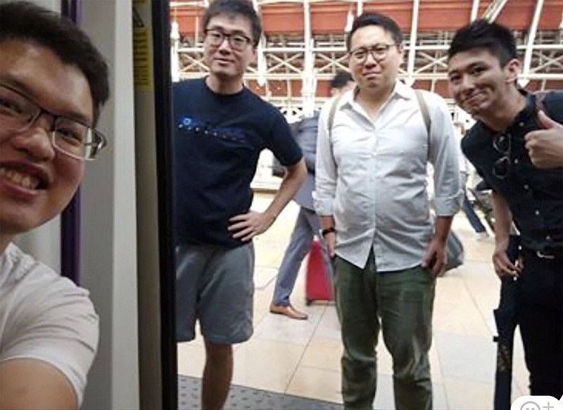 This photo provided by Wilson Li shows Simon Cheng Man-kit, second left, a resident of Hong Kong.  China said Simon Cheng Man-kit, a staffer at the British consulate in Hong Kong, has been given 15 days of administrative detention in the neighboring mainland city of Shenzhen for violating regulations on public order, Wednesday, Aug. 21, 2019. The case is stoking fears that Beijing is extending its judicial reach to semi-autonomous Hong Kong.  (Wilson Li via AP)