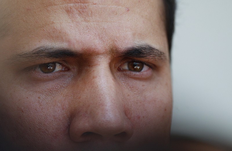 Opposition leader and self-proclaimed interim president of Venezuela, Juan Guaido, speaks to the press at the National Assembly in Caracas, Venezuela, Tuesday, Aug. 20, 2019. The opposition-controlled National Assembly meets every Tuesday, and today lawmakers met to discuss the government's bid to relieve hyperinflation. (AP Photo/Leonardo Fernandez)