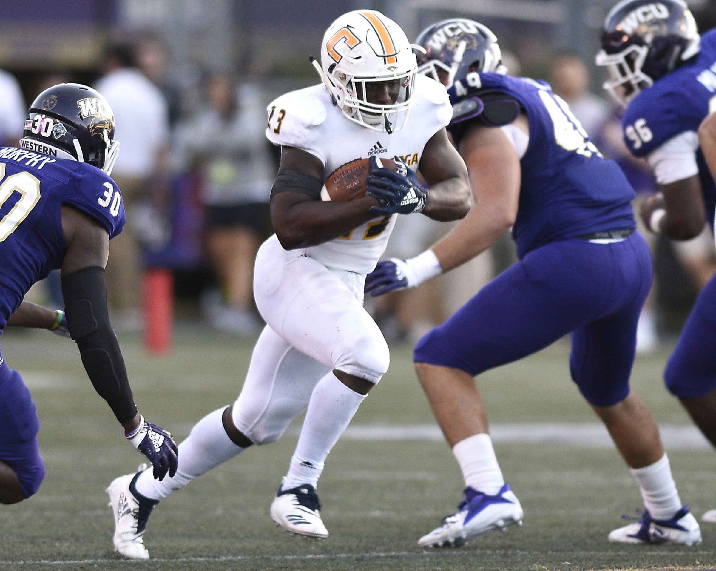 UTC's Tyrell Price (23) gets between two Western defenders. The University of Tennessee Chattanooga Mocs visit the Western Carolina Catamounts in Southern Conference action on October 13, 2018