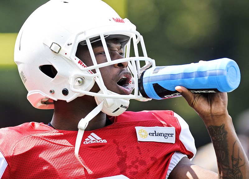 UTC receiver Demarcus Williams cools off with a quick drink of water during practice Aug. 5 at Scrappy Moore Field. Williams, a redshirt junior who transferred from Minnesota, is among those battling for one of the two open starting spots at receiver alongside Bryce Nunnelly.