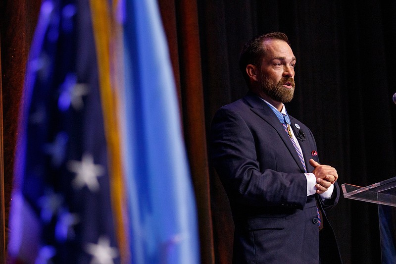 Medal of Honor recipient Clint Romesha speaks during the third annual Celebration of Valor luncheon at the Chattanooga Convention Center on Wednesday, benefiting the Charles H. Coolidge National Medal of Honor Heritage Center.
