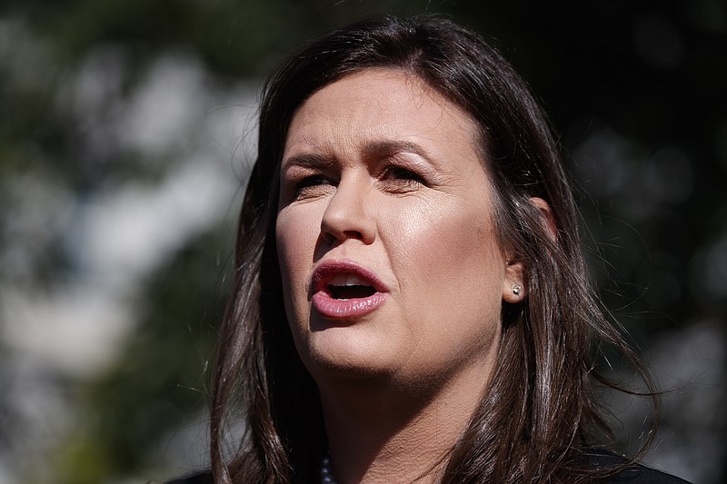 In this June 11, 2019 file photo, White House press secretary Sarah Sanders talks with reporters outside the White House in Washington. The former White House Press Secretary who once sparred with journalists, has decided to join them. Fox News said Thursday, Aug. 22 Sanders has been hired to provide political commentary and analysis across all its properties, including Fox News Channel, Fox Business Network and the radio and podcast division. (AP Photo/Evan Vucci, File)