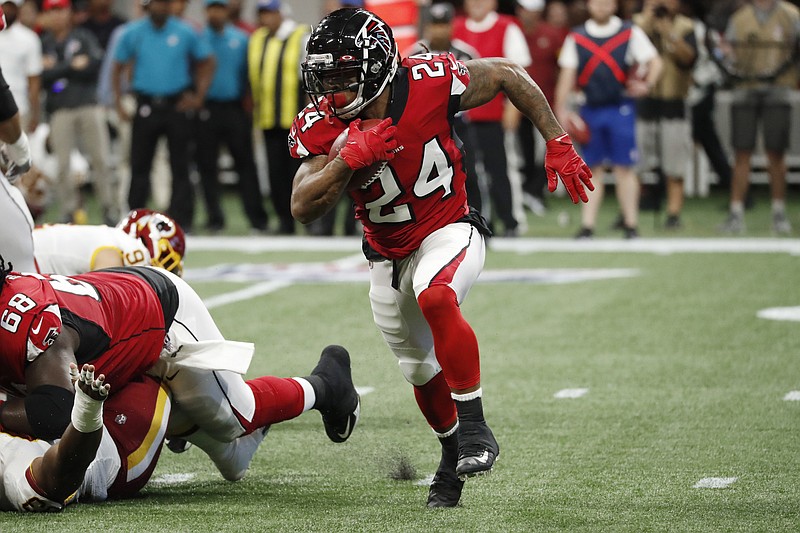 Atlanta Falcons running back Devonta Freeman sprints out of the backfield against the Washington Redskins during a preseason game Thursday night in Atlanta.