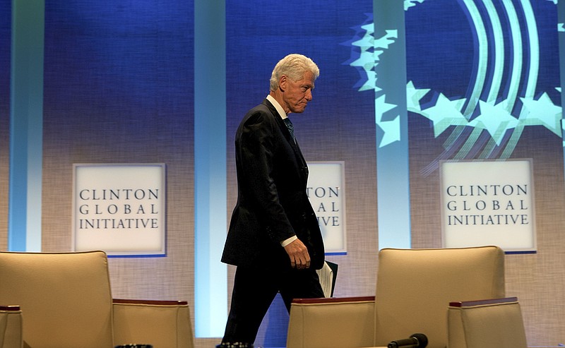 Former President Bill Clinton, shown walking on stage at a Clinton Global Initiative event in 2010, apparently had a close friendship with accused sex trafficker Jeffrey Epstein, such a friendship that Epstein hung an unusual portrait of the former president in his Manhattan townhouse. (Doug Mills/The New York Times)