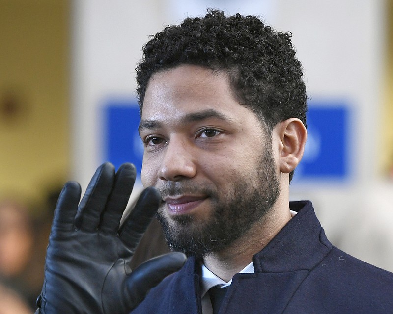 In this March 26, 2019, file photo, actor Jussie Smollett smiles and waves to supporters before leaving Cook County Court after his charges were dropped in Chicago. An Illinois judge seems close to appointing a special prosecutor to look into why state prosecutors abruptly dropped charges against Smollett accusing him of staging a racist, anti-gay attack against himself. A hearing Friday, Aug. 23 will be one of the first opportunities for Judge Michael Toomin to name someone since his surprise ruling in June that a special prosecutor was warranted. Among the options available to a special prosecutor would be to restore charges against Smollett. (AP Photo/Paul Beaty, File)