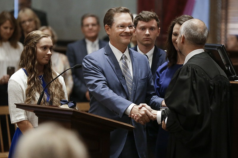 Rep. Cameron Sexton, R-Crossville, center, is congratulated after being sworn in as House Speaker during a special session of the Tennessee House Friday, Aug. 23, 2019, in Nashville, Tenn. (AP Photo/Mark Humphrey)