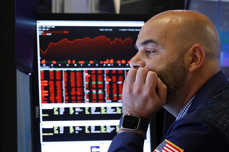 Trader Fred DeMarco works on the floor of the New York Stock Exchange, Friday, Aug. 23, 2019. Stocks tumbled on Wall Street after President Donald Trump said he "hereby ordered" U.S. companies to consider alternatives to doing business in China. (AP Photo/Richard Drew)