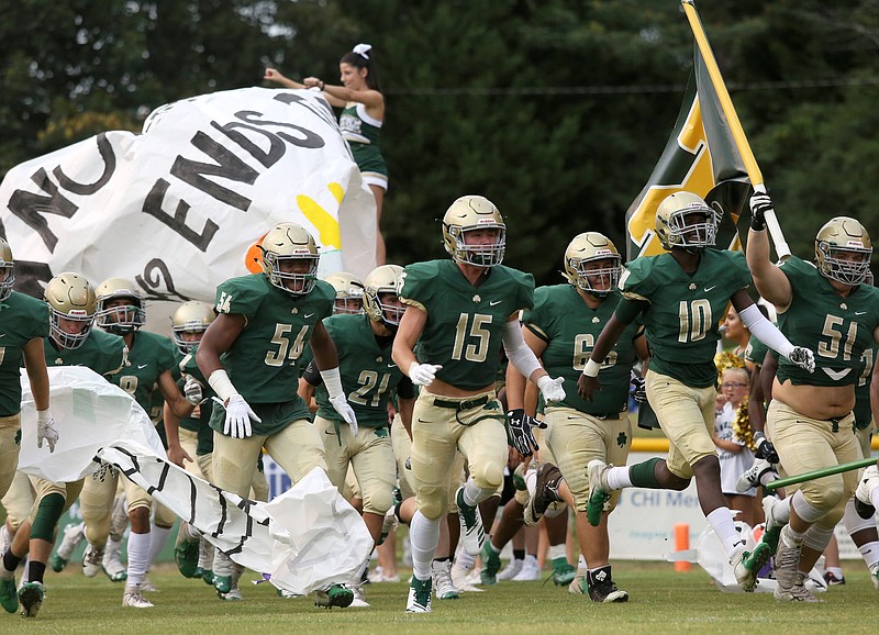Staff photo by Erin O. Smith / Notre Dame football players make their way through the run-through prior to the Notre Dame vs. Central football game Friday, August 23, 2019 at Notre Dame High School in Chattanooga, Tennessee. 