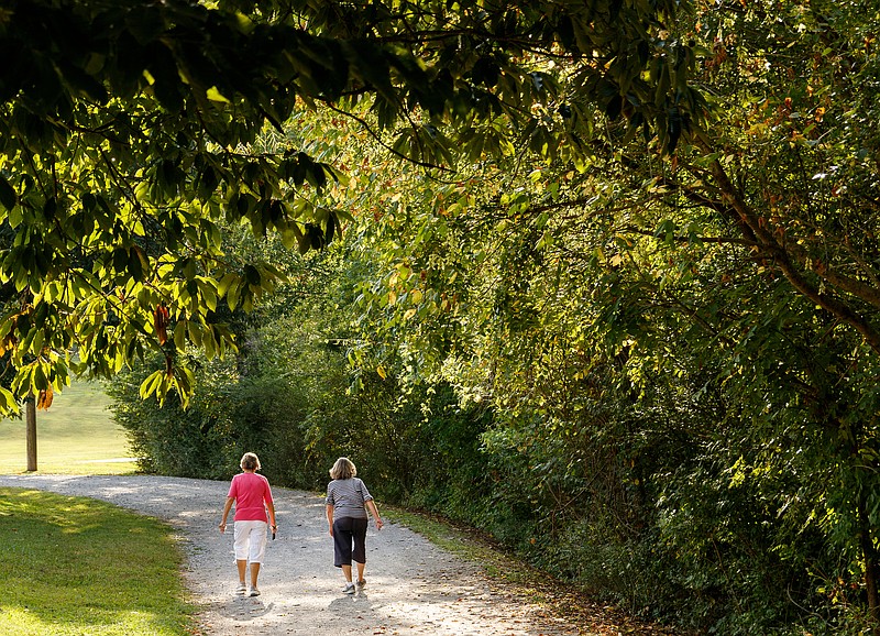 Staff photo by Doug Strickland/ People walk at Greenway Farm on Wednesday, Aug. 21, 2019, in Chattanooga, Tenn. The North Chickamauga Creek Greenway, accessible from Greenway Farm, will be a part of the interconnected Great Eastern Trail.