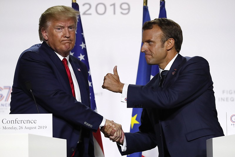 French President Emmanuel Macron and U.S President Donald Trump shake hands during the final press conference during the G7 summit Monday, Aug. 26, 2019 in Biarritz, southwestern France. French president says he hopes for meeting between US President Trump and Iranian President Rouhani in coming weeks. (AP Photo/Francois Mori)