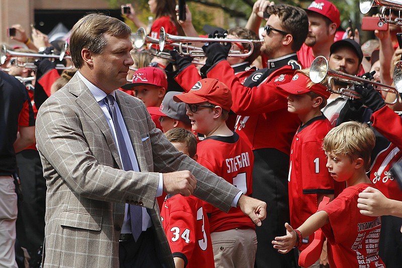 Staff photo by C.B. Schmelter / Georgia football coach Kirby Smart greets fans during the Dawg Walk before his team's game against Tennessee on Sept. 29, 2018, in Athens, Ga.