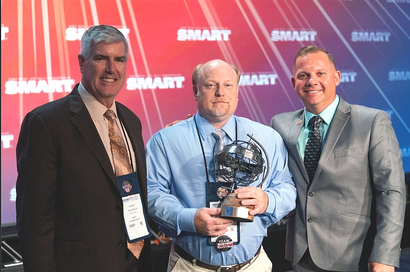 Photo by Union Sportsmen's Alliance / SMART general president Joseph Sellers Jr., left, and Union Sportsmen's Alliance CEO Scott Vance, right, present Dunlap resident Jeff Burgin with the SMART conservation steward of the year award.