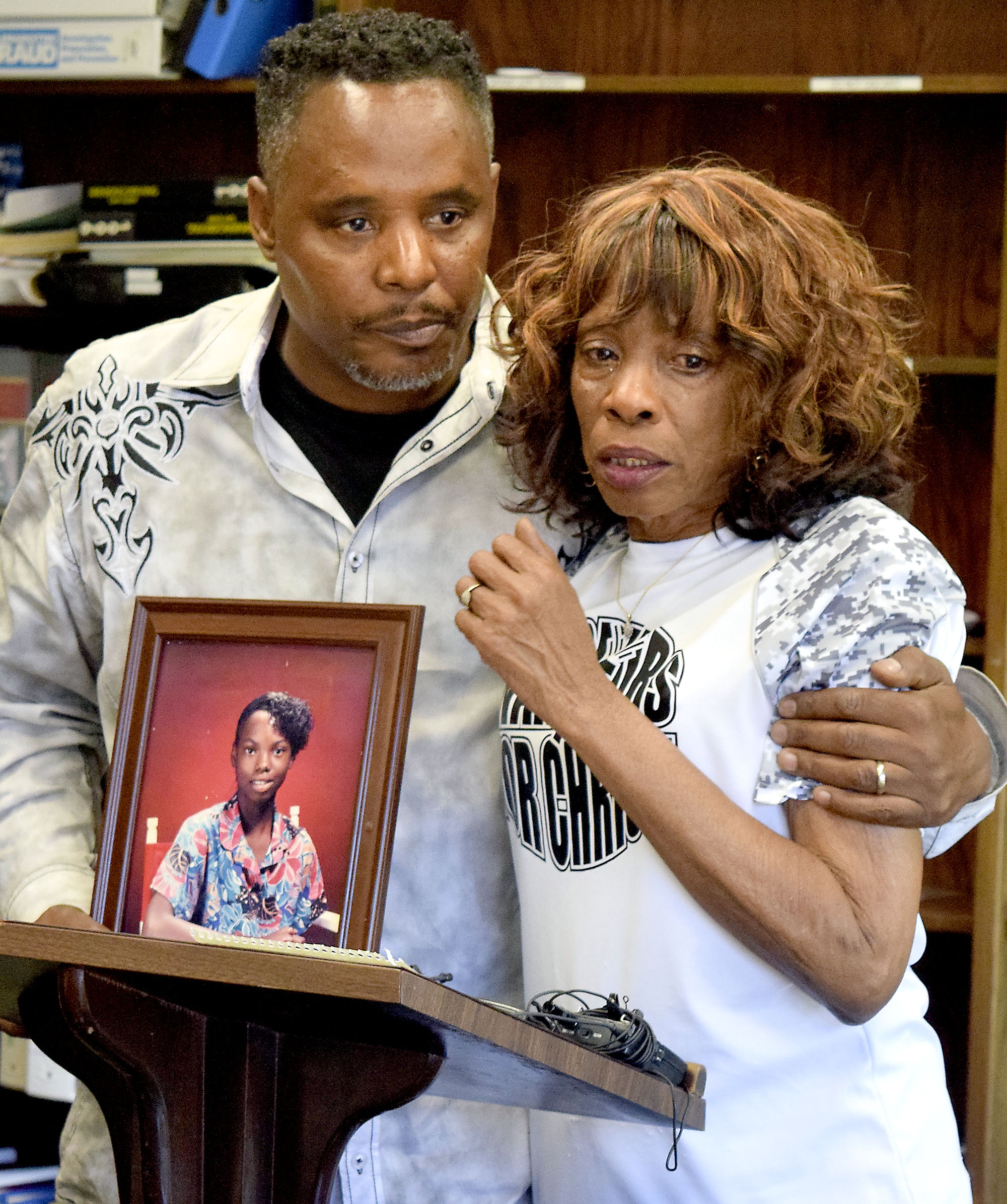 Staff Photo by Robin Rudd/ Tonetta Carlisle's brother, Darrell Stewart comforts his mother Nonie Sturdivant during a press conference discussing the recent developments in the case of Tonetta's disappearance. The Hamilton County District Attorney office announced the reopening of a cold case. Tonetta Carlisle was 15-years old when she disappeared on March 16, 1989. Jeffery Jones was listed as a person-of-interest during the press conference held on August 29, 2019.