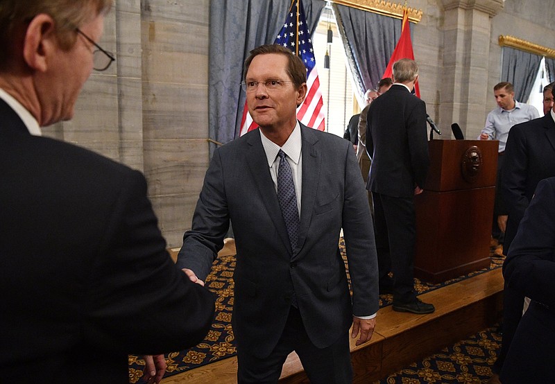 State Rep. Cameron Sexton, right, is congratulated after winning the Republican nomination as Speaker of the House during a Republican Caucus meeting in the Old Supreme Court Chambers on the first floor of the Capitol, Wednesday, July 24, 2019, in Nashville, Tenn. (Larry McCormack/The Tennessean via AP)