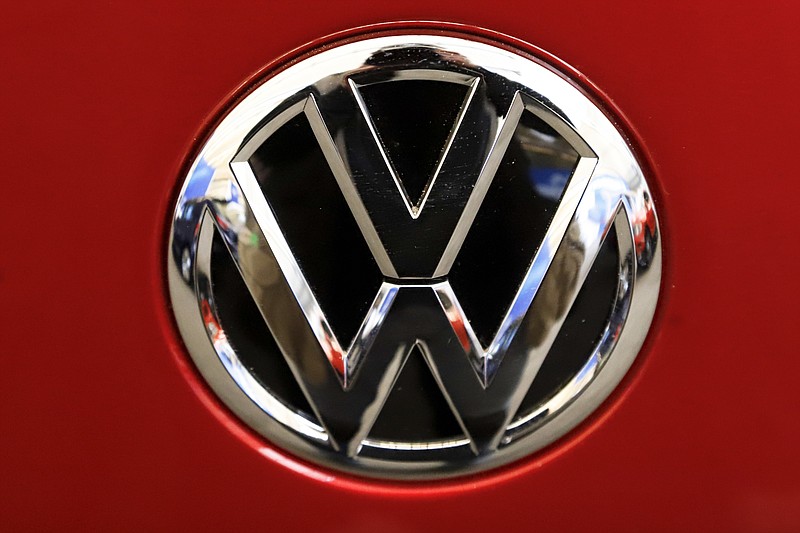 This Thursday, Feb. 14, 2019, file photo, shows the Volkswagen logo on an automobile at the 2019 Pittsburgh International Auto Show in Pittsburgh. The U.S. Environmental Protection Agency is making Volkswagen Group correct fuel economy labels for about 98,000 gasoline-powered vehicles from the 2013 through 2017 model years. (AP Photo/Gene J. Puskar, File)