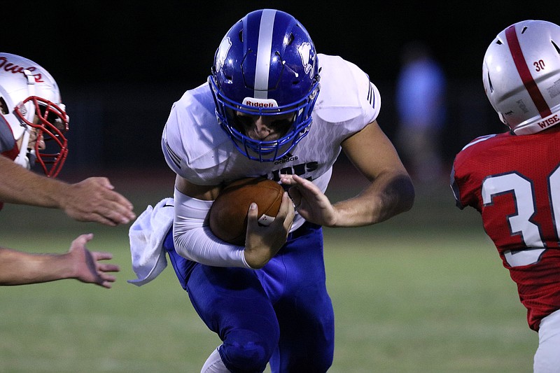 Staff photo by Erin O. Smith / Red Bank quarterback Madox Wilkey (7) runs the ball during the Ooltewah vs. Red Bank football game Friday, August 30, 2019 in Ooltewah, Tennessee.