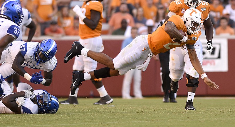 Staff Photo by Robin Rudd/  Tennessee quarterback Jarrett Guarantano (2) dives for extra yards after being hit by Panter defenders.  The University of Tennessee Volunteers opened the season wit the Georgia State Panthers at Neyland Stadium on August 31, 2019.  