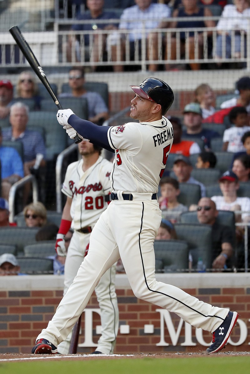 Atlanta Braves' Freddie Freeman follows through on a two-run homer in the sixth inning of a baseball game against the Chicago White Sox Sunday, Sept. 1, 2019, in Atlanta. It was Freeman's second two-run home run of the game. (AP Photo/John Bazemore)