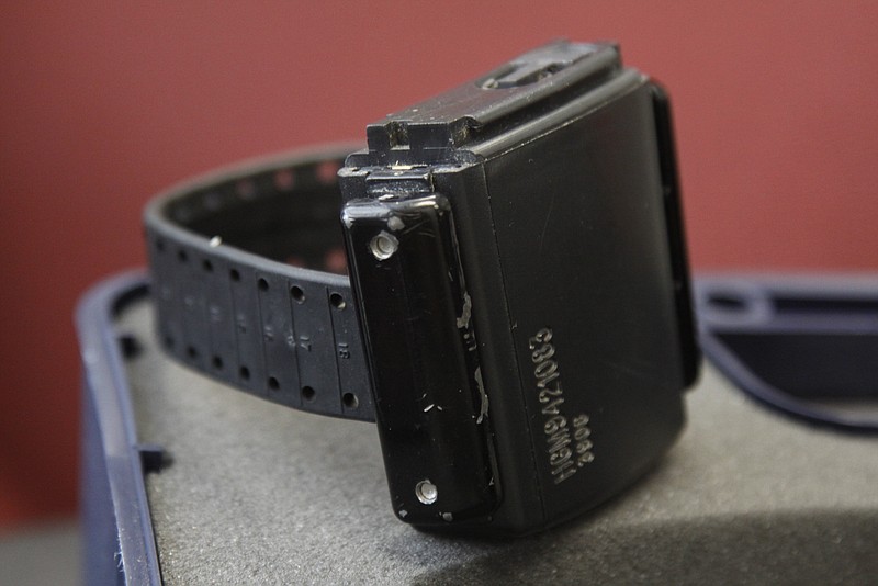 Staff file photo/ An ankle bracelet used for the "house arrest" rests on a desk at the Hamilton County Community Corrections and Alternative Sentencing facility in July 2011.